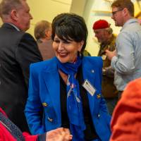 President talking to two faculty members